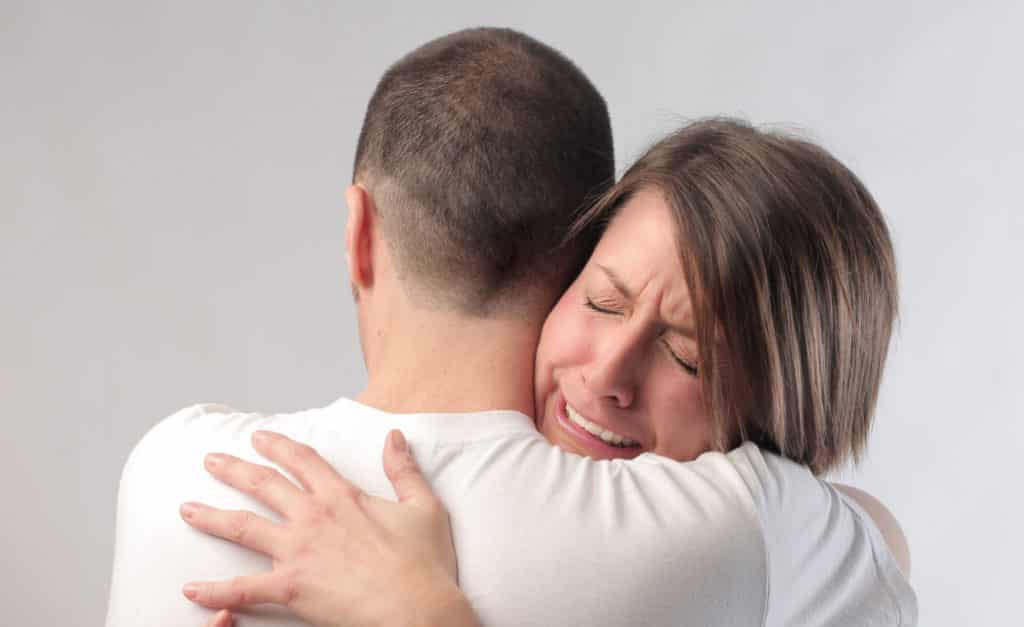 Wife crying with husband